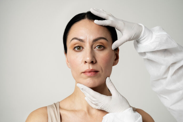 Woman receiving exam before dermal fillers