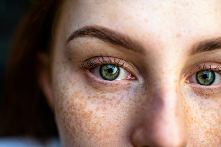 Woman with green eyes staring ahead